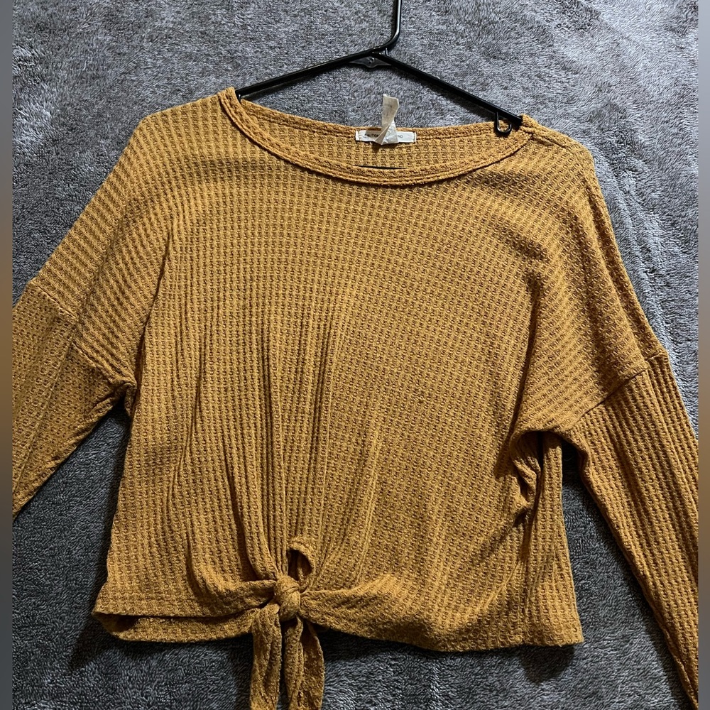 Yellow sweater tied in front